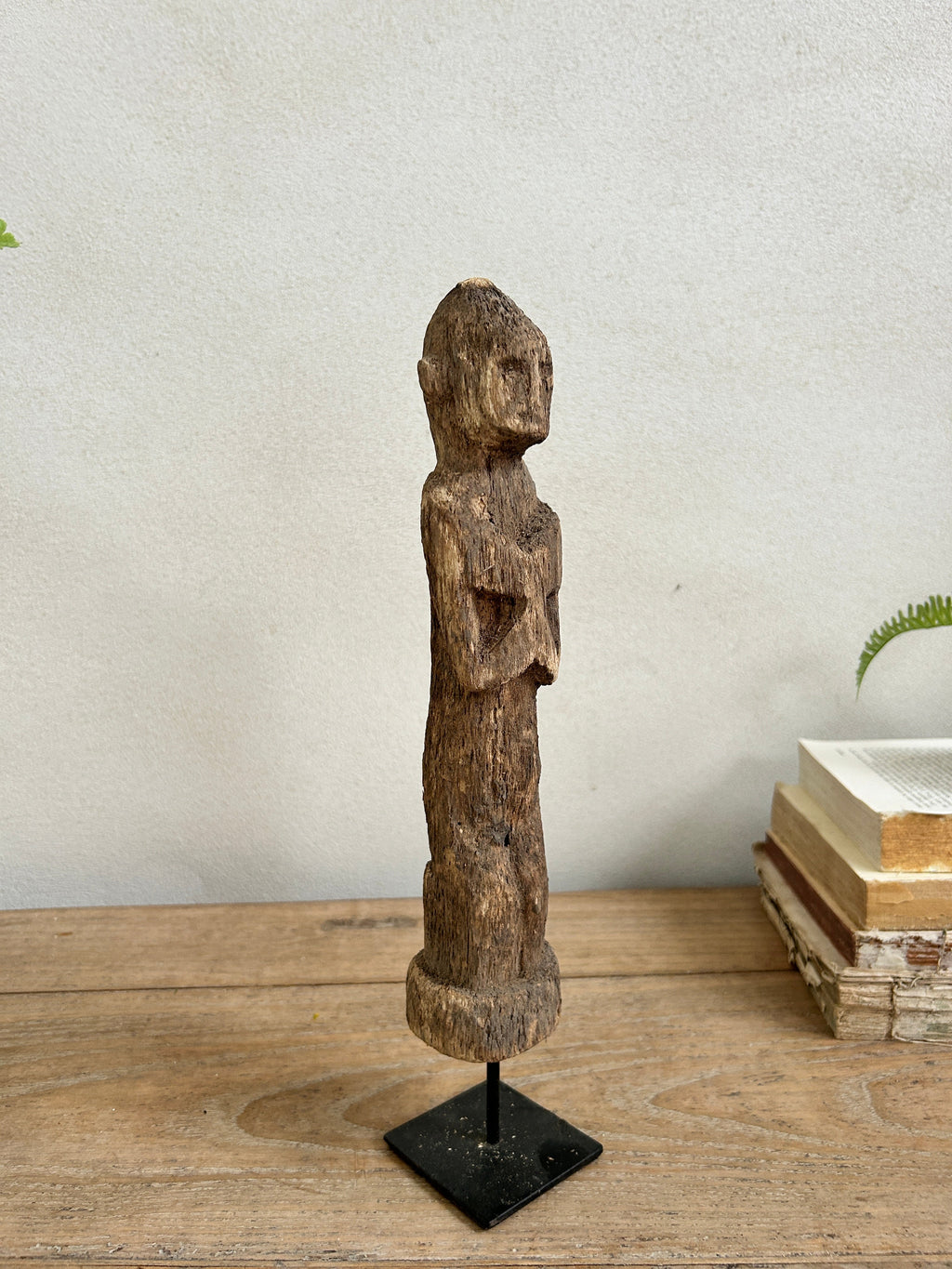 Antique hand-carved wooden statues on stand | Wira