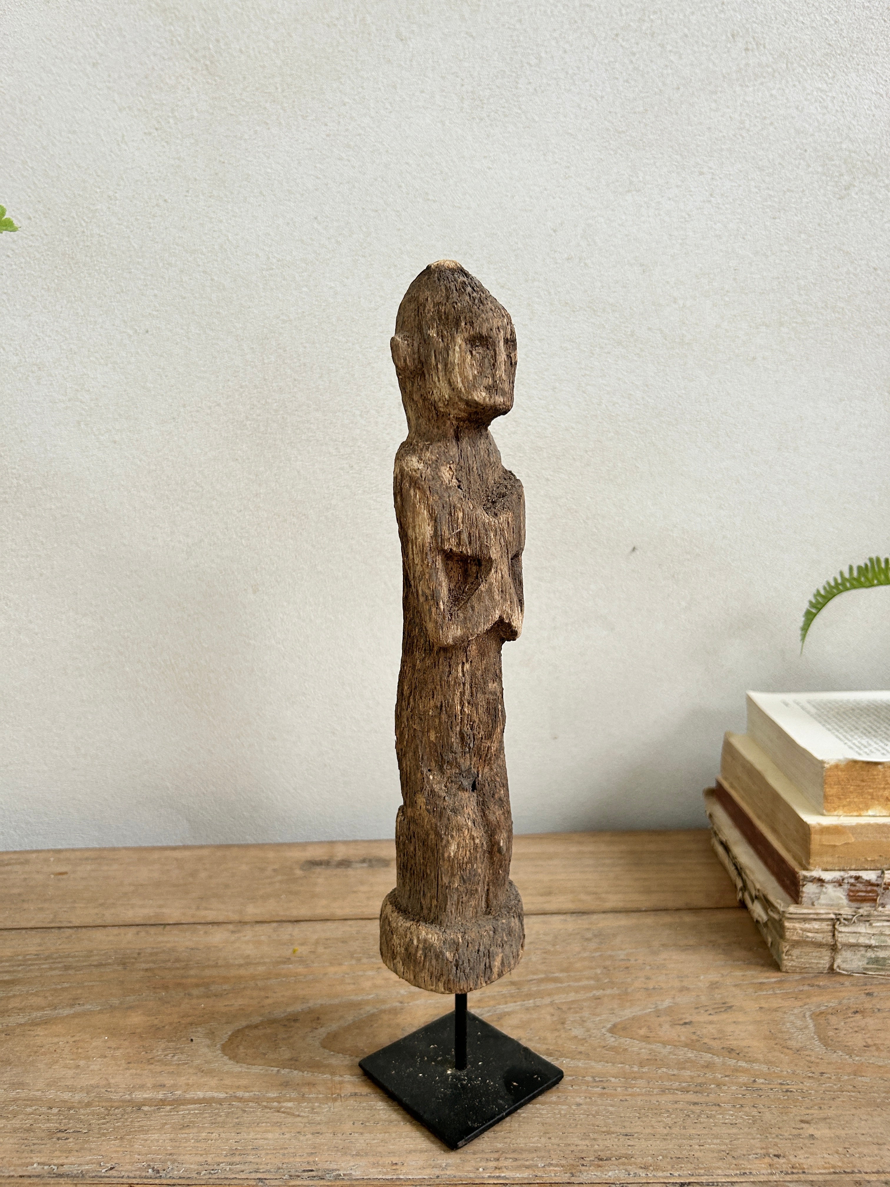 Antique hand-carved wooden statues on stand | Wira