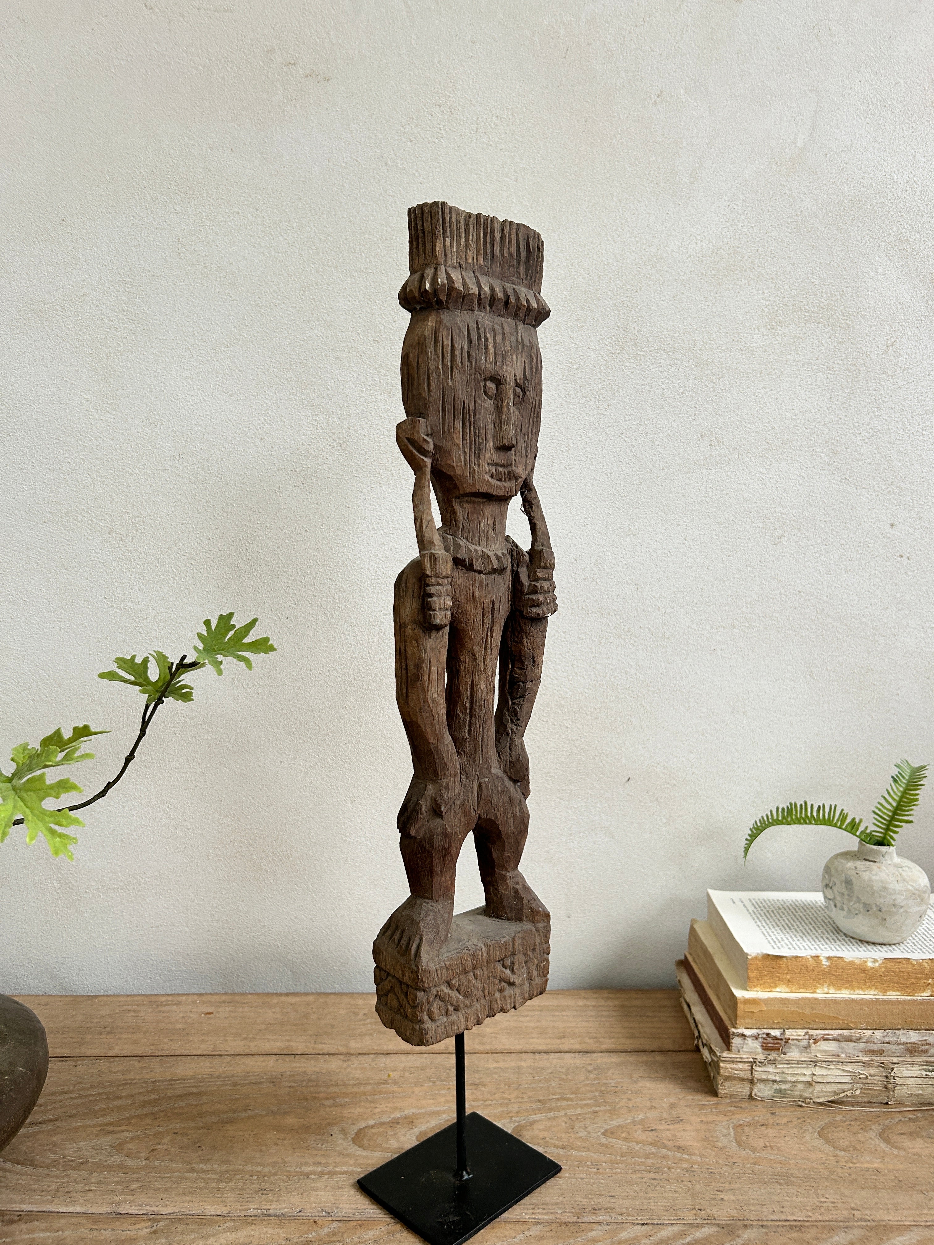 Antique hand-carved wooden statues on stand | Wira