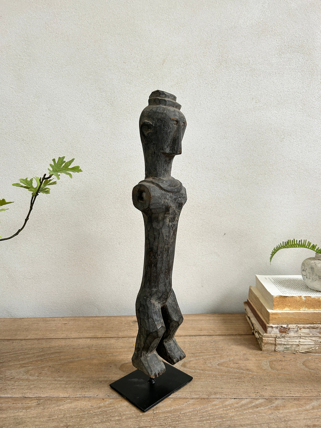 Antique hand-carved wooden statues on stand | Wira