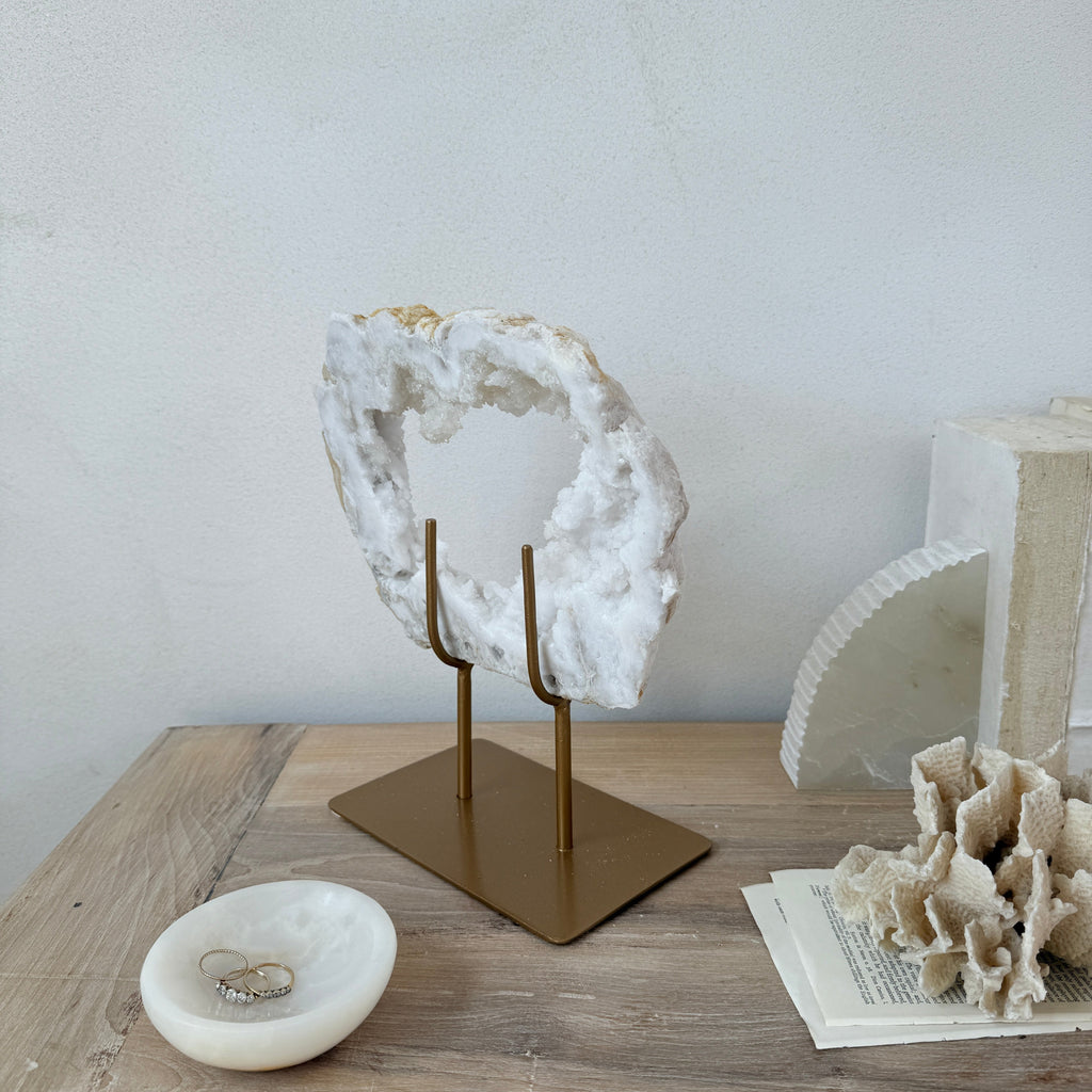 Natural crystal sculpture on stand