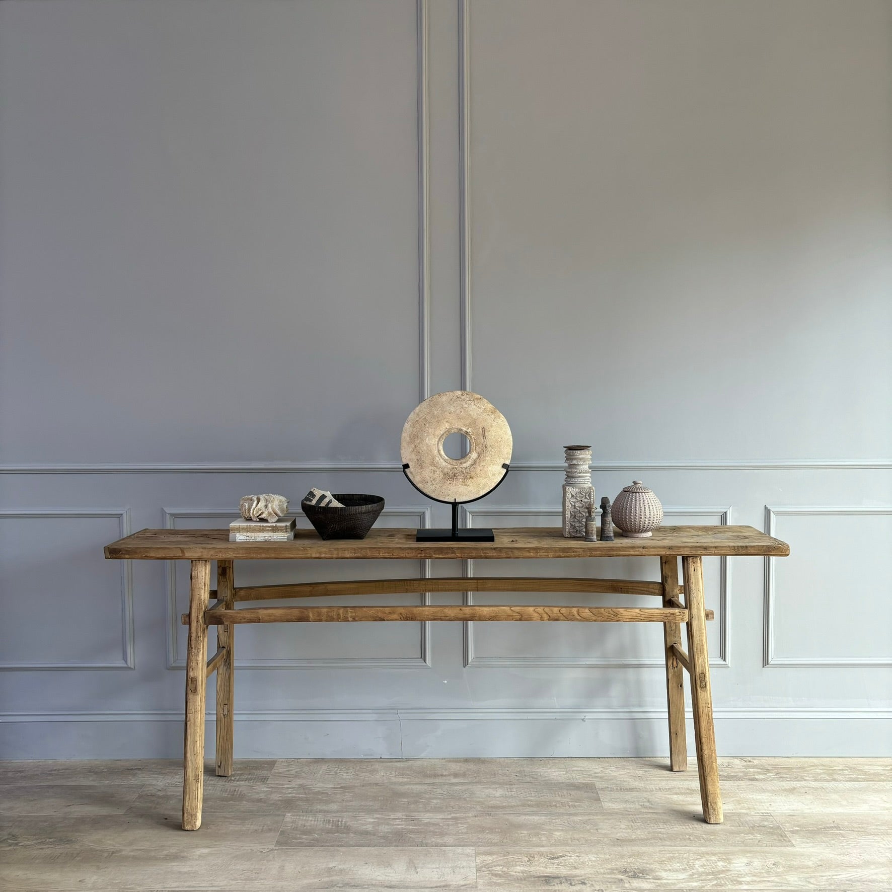 Large sandstone disc on stand